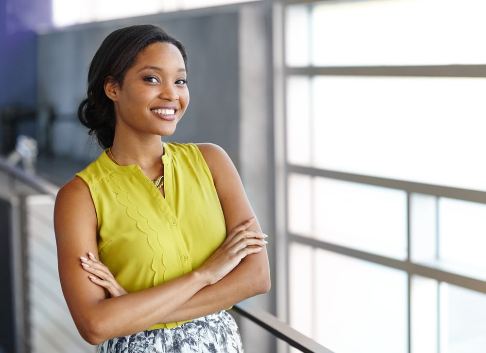 Portrait of a confident black businesswoman at work in her glass office-1