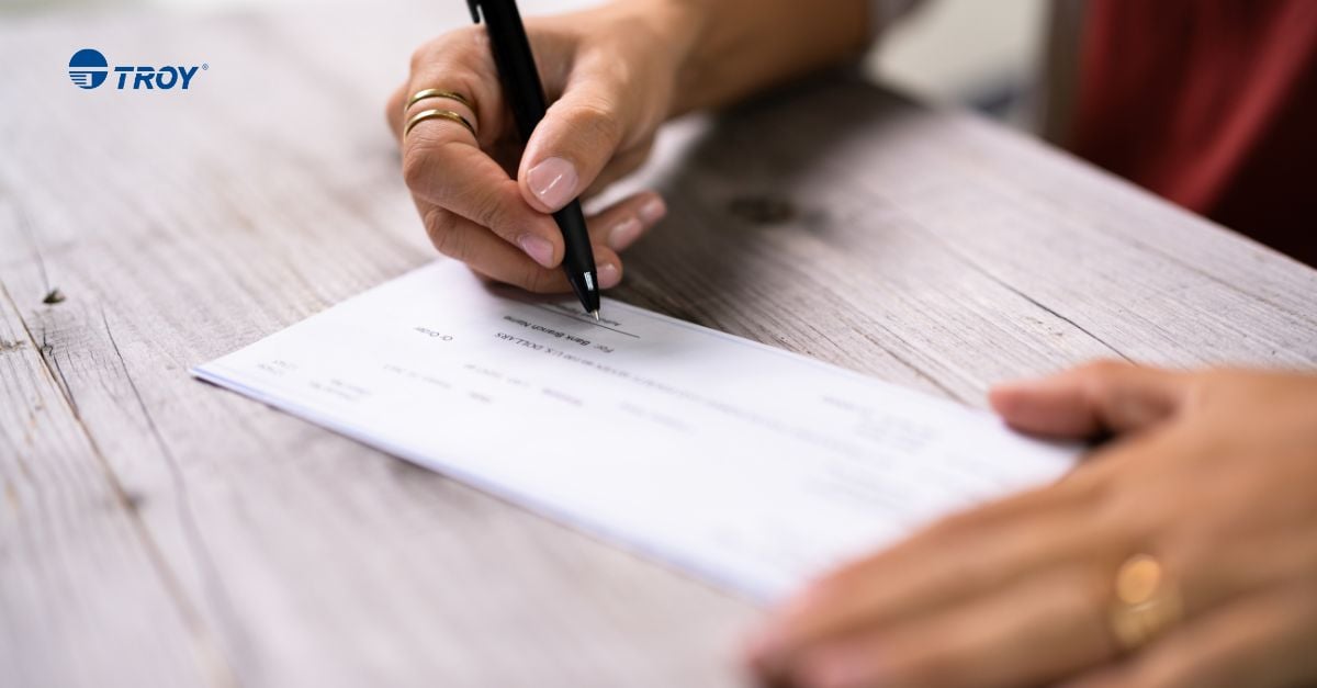 Pessoa que preenche os campos de um cheque